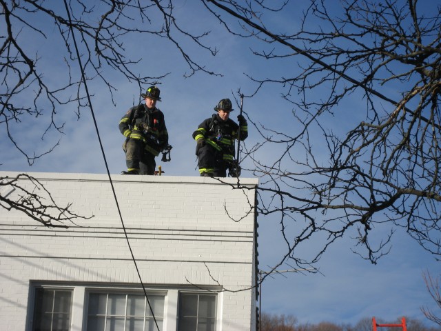 Lieut Bancroft and Ex Chief Lombardo work the roof on Katonah ave December 07